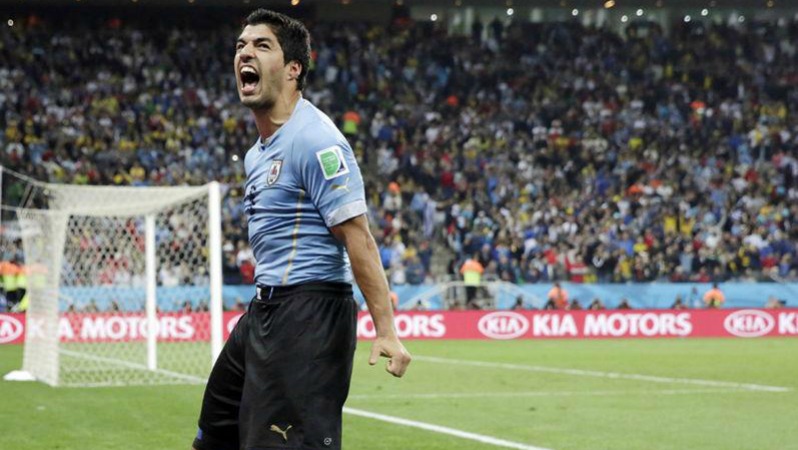 Barcelona attack: Suarez yells in triumph after scoring a goal.