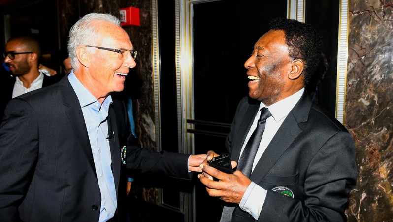 Beckenbauer and Pele shaking hands in the 21st century