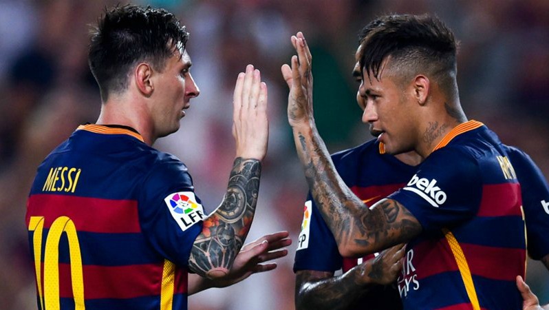 Messi and Neymar high five during a game. 