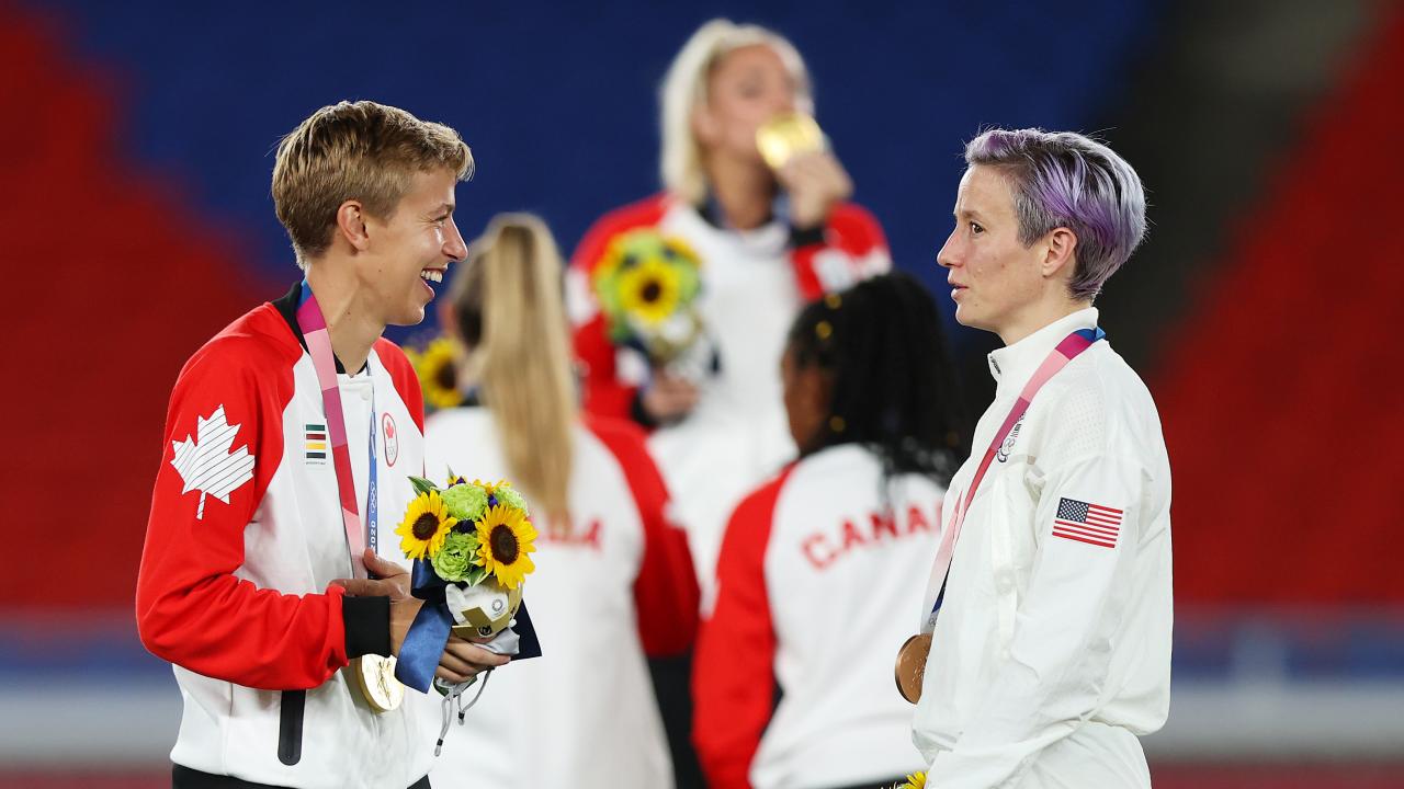 Quinn and Megan Rapinoe talk after the medal ceremony for women's soccer at the Tokyo Olympics