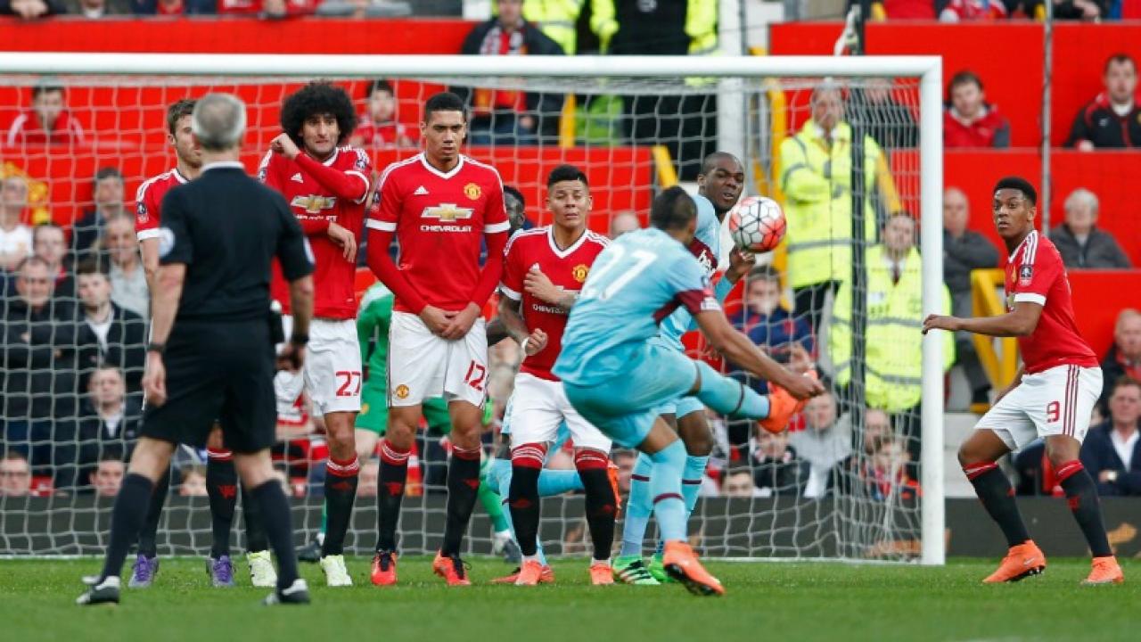 Dimitri Payet curls a freekick vs Man U