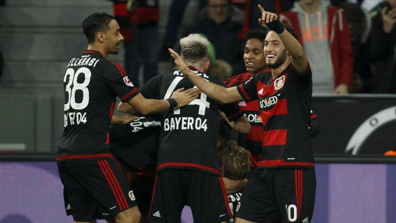 Calhanoglu celebrates with his teammates. 