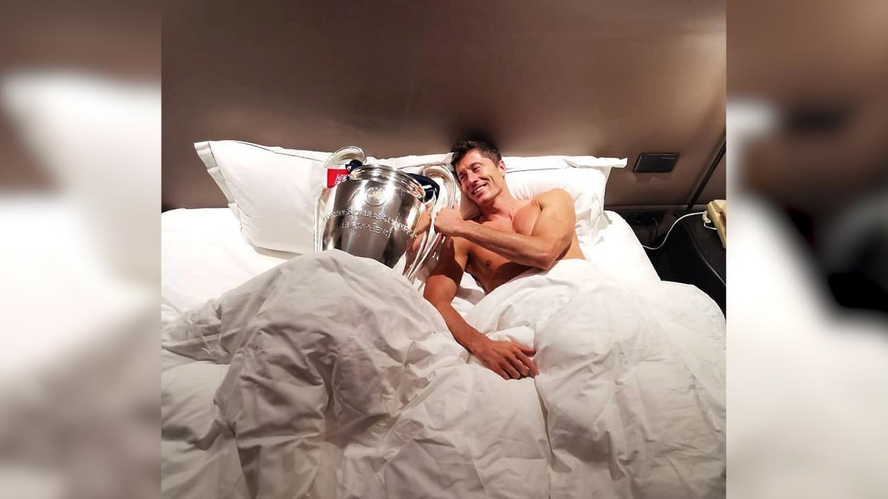 Lewandowski lies in bed with his shiny new trophy 