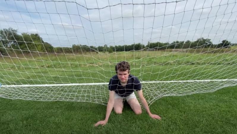 Brendan O'Hare stuck inside a soccer net