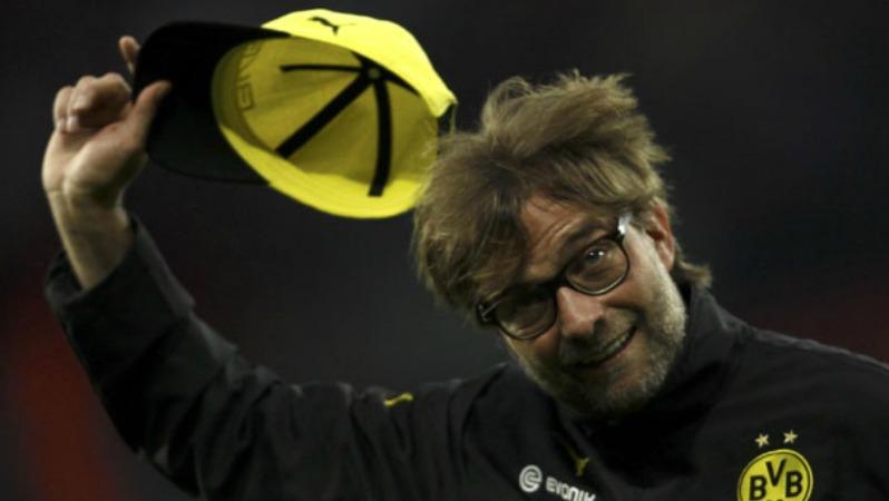 Jurgen Klopp salutes the Dortmund fans upon his departure.