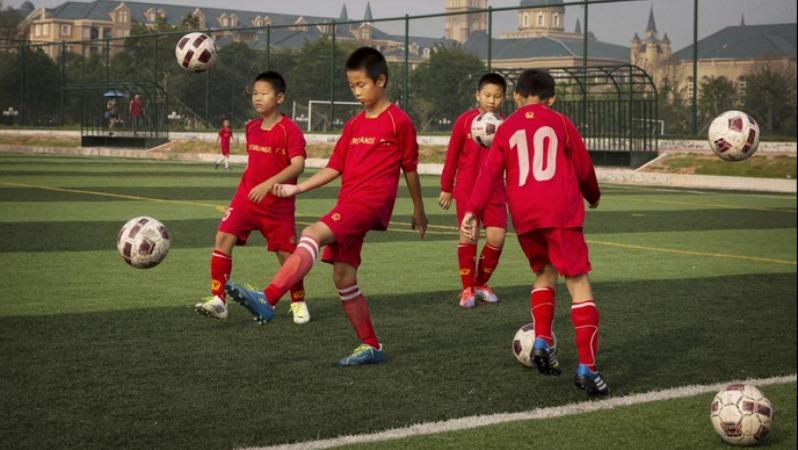 Chinese children practicing soccer