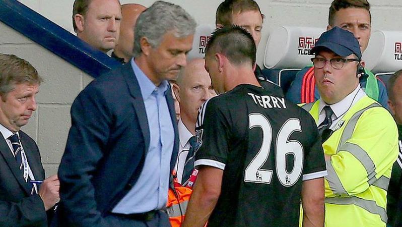 John Terry walking off the pitch after receiving a red card in a match against West Brom with Jose Mourinho looking on