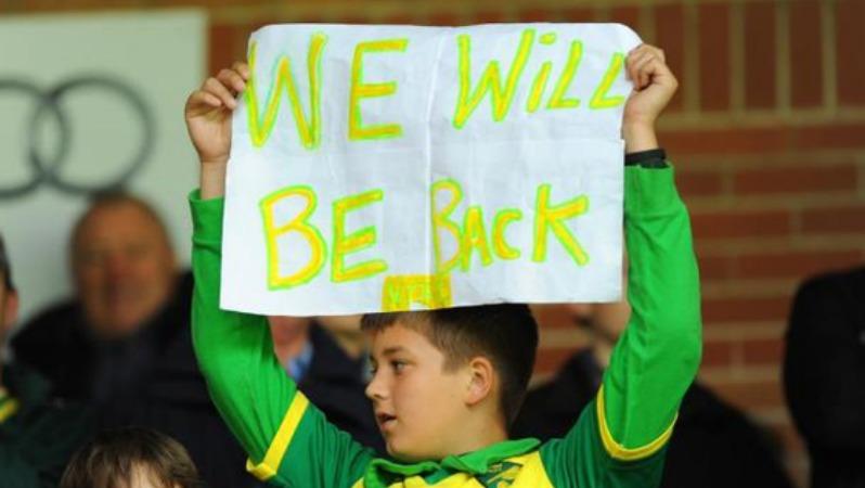Norwich fan holds up sign in hopes of being promoted
