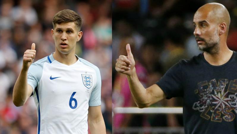 Pep Guardiola and John Stones