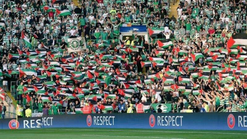 Celtic fans raise the flag for Palestine.