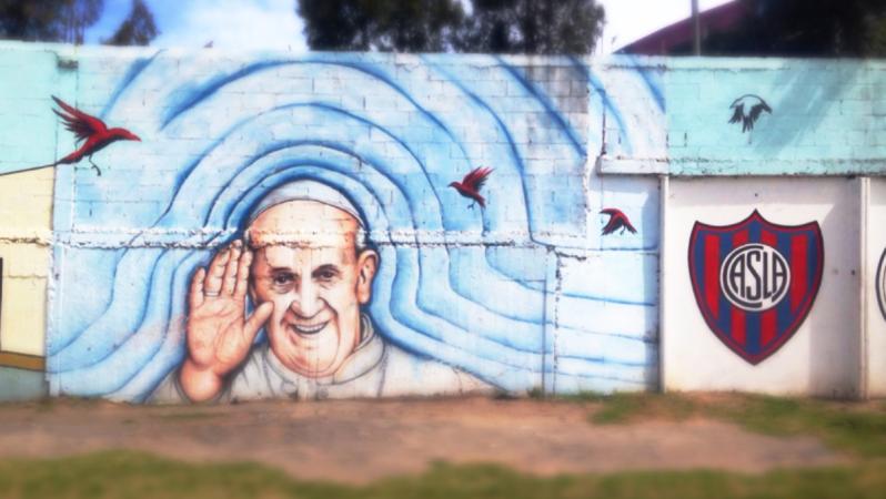 A mural of the Pope outside San Lorenzo