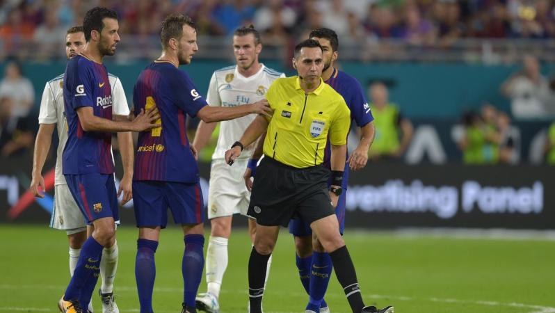 Ivan Rakitic and Jair Marrufo