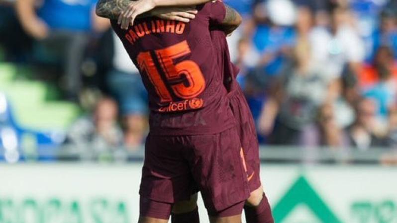 Paulinho and Lionel Messi