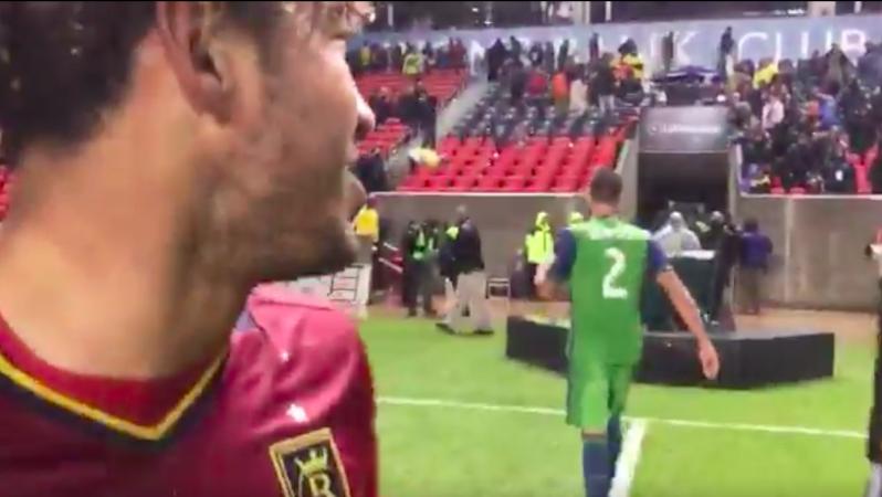 Danilo Acosta and Clint Dempsey exchange words.