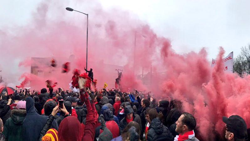 The atmosphere outside Anfield is full of smoke, fire and exactly what you'd expect.