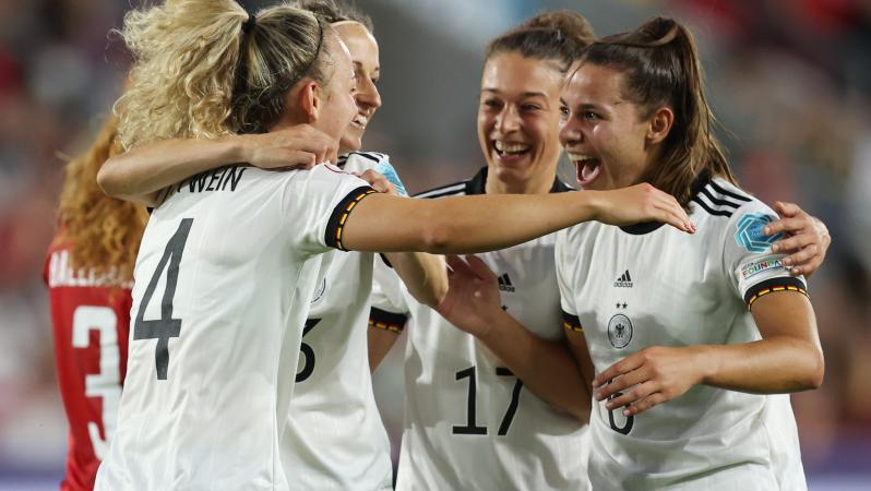 Germany players celebrate their third goal against Denmark