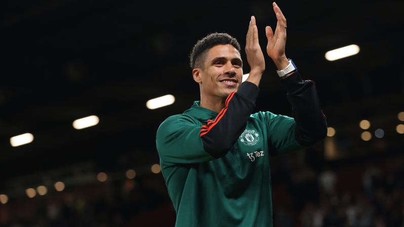 Raphaël Varane applauds fans at Old Trafford