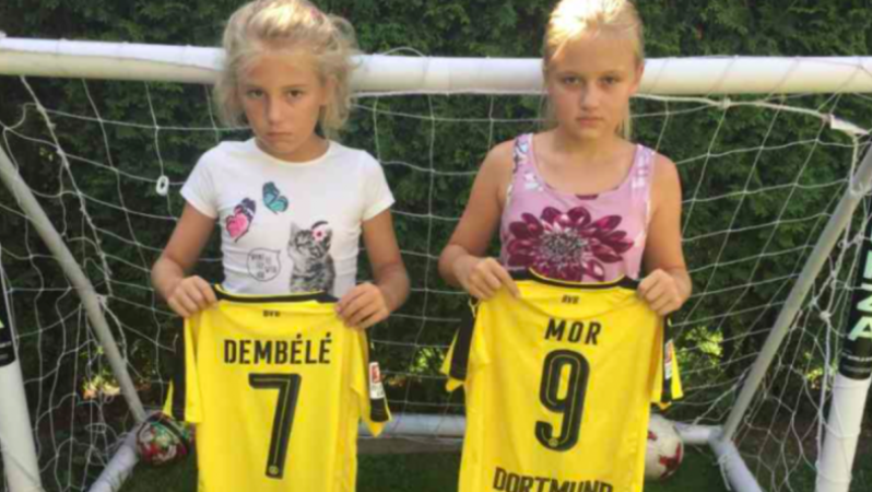 Mario Götze gives jerseys to two young Dortmund fans