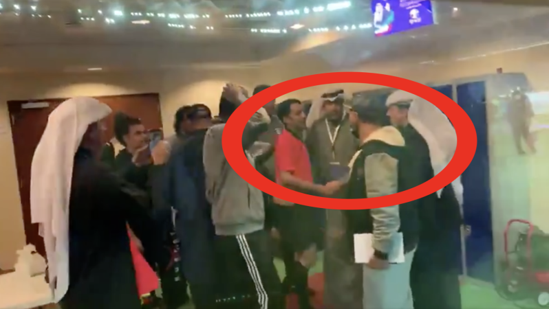 Team celebrates with referee