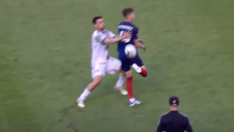 Chicago Fire player Brian Gutiérrez assisting Jhon Durán against Toronto FC