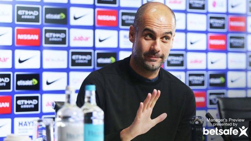 Pep at a press conference.