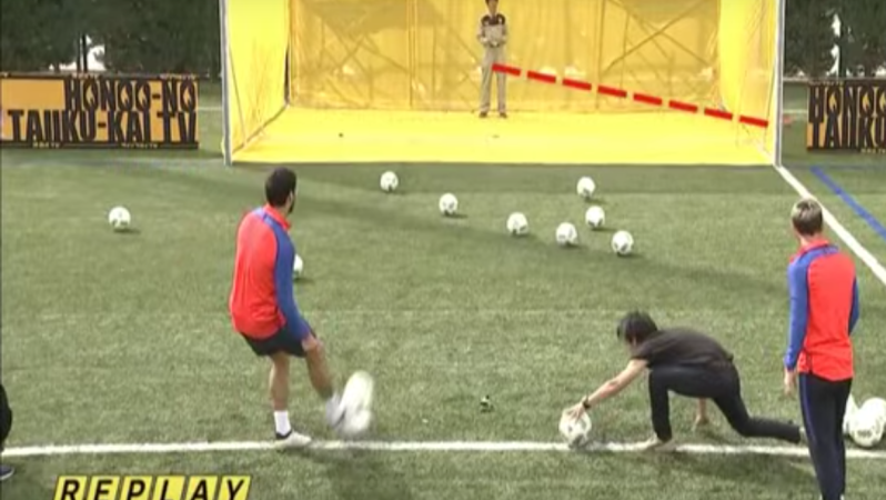 Luis Suarez and Lionel Messi kick soccer balls a drones 