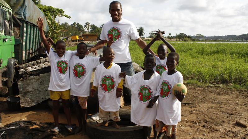Didier Drogba helping the Ivory Coast 