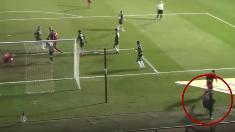  Leyton Orient player pushes ball boy