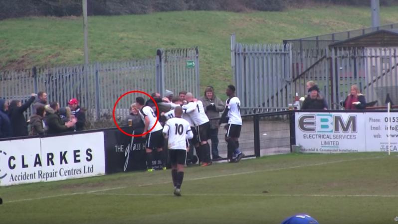 Colby Town player drinks a beer