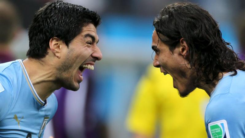 Suarez and Uraguay teammate celebrate a goal
