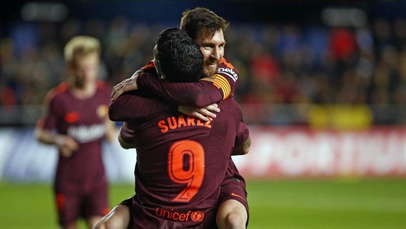 Lionel Messi and Luis Suarez hug as LaLiga champions