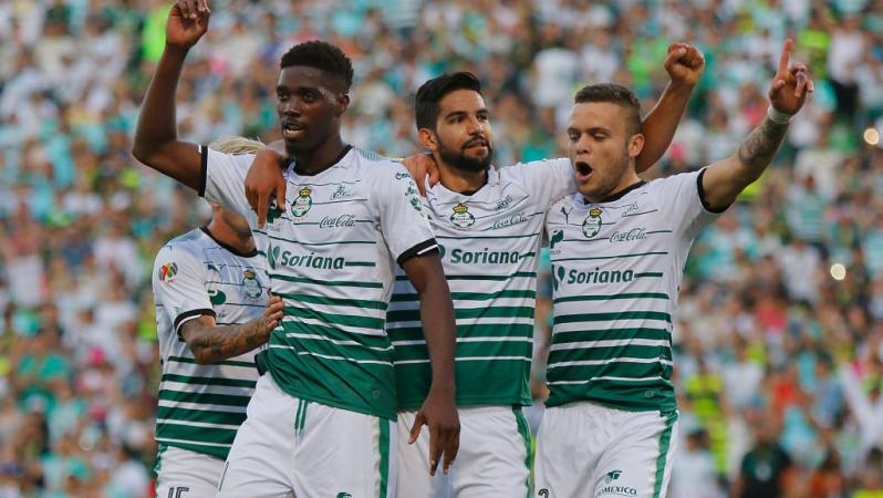 Santos teammates celebrate a goal leading into the semifinals.