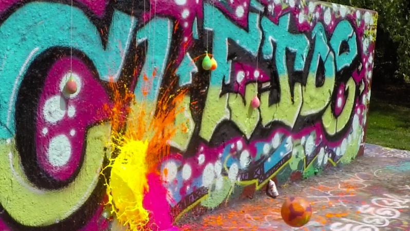 Popping Paint Balloons Hanging On A Graffiti Wall