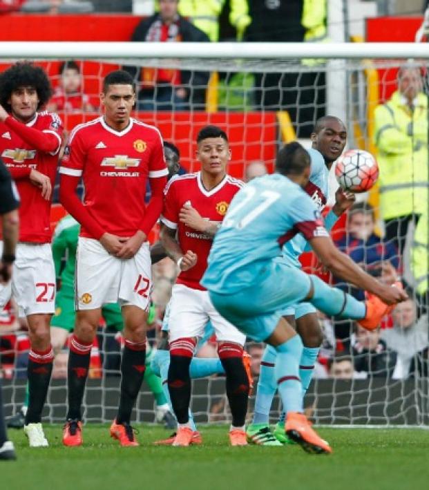 Dimitri Payet curls a freekick vs Man U