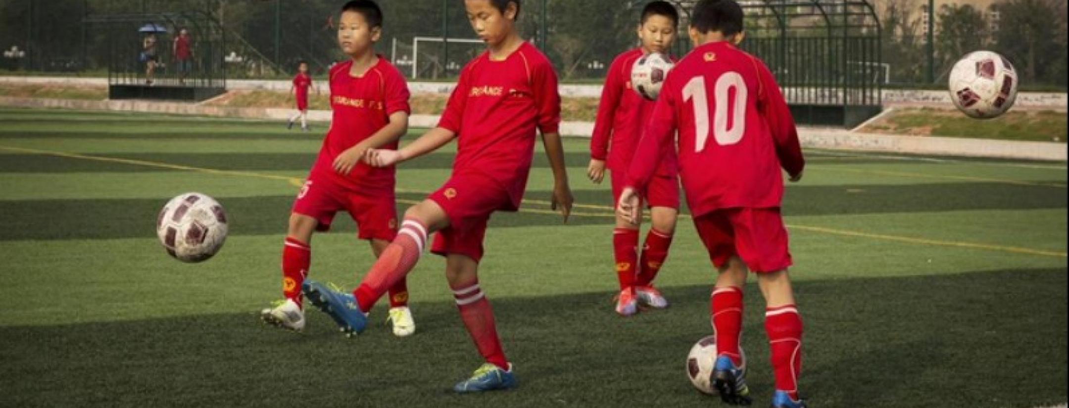 Chinese children practicing soccer