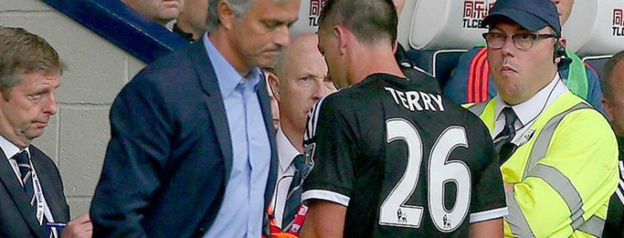 John Terry walking off the pitch after receiving a red card in a match against West Brom with Jose Mourinho looking on
