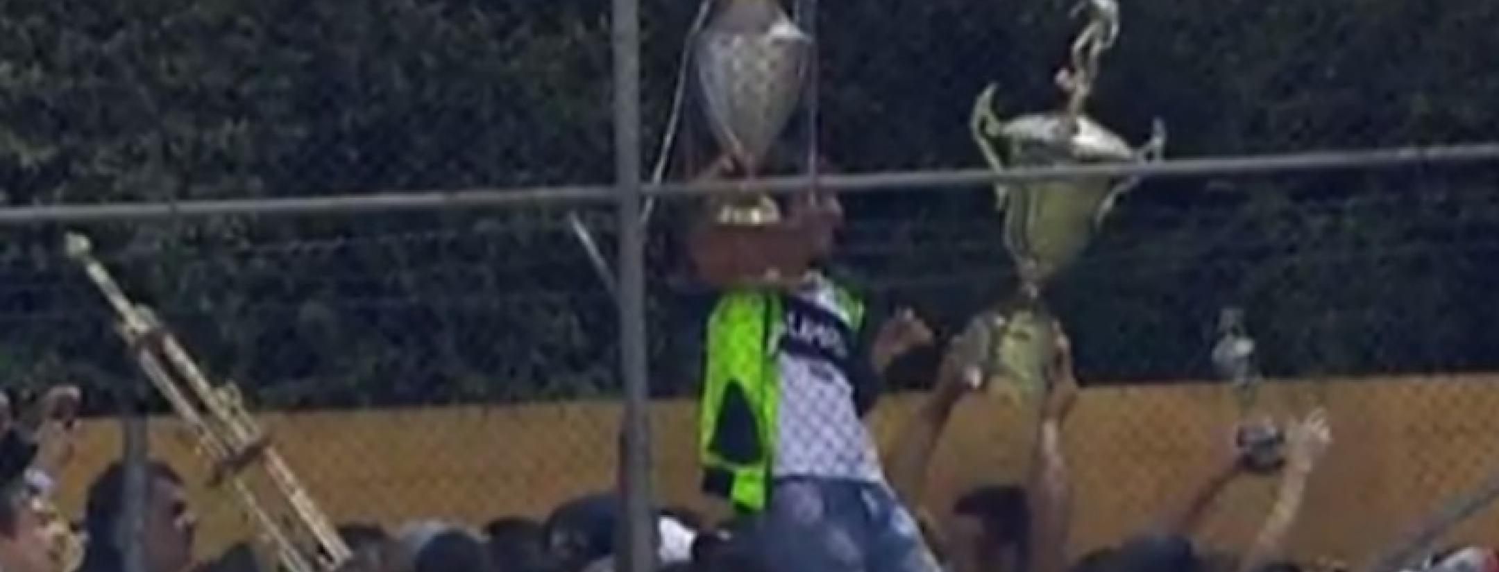 Paraguayan fans parade around with trophies of their rivals