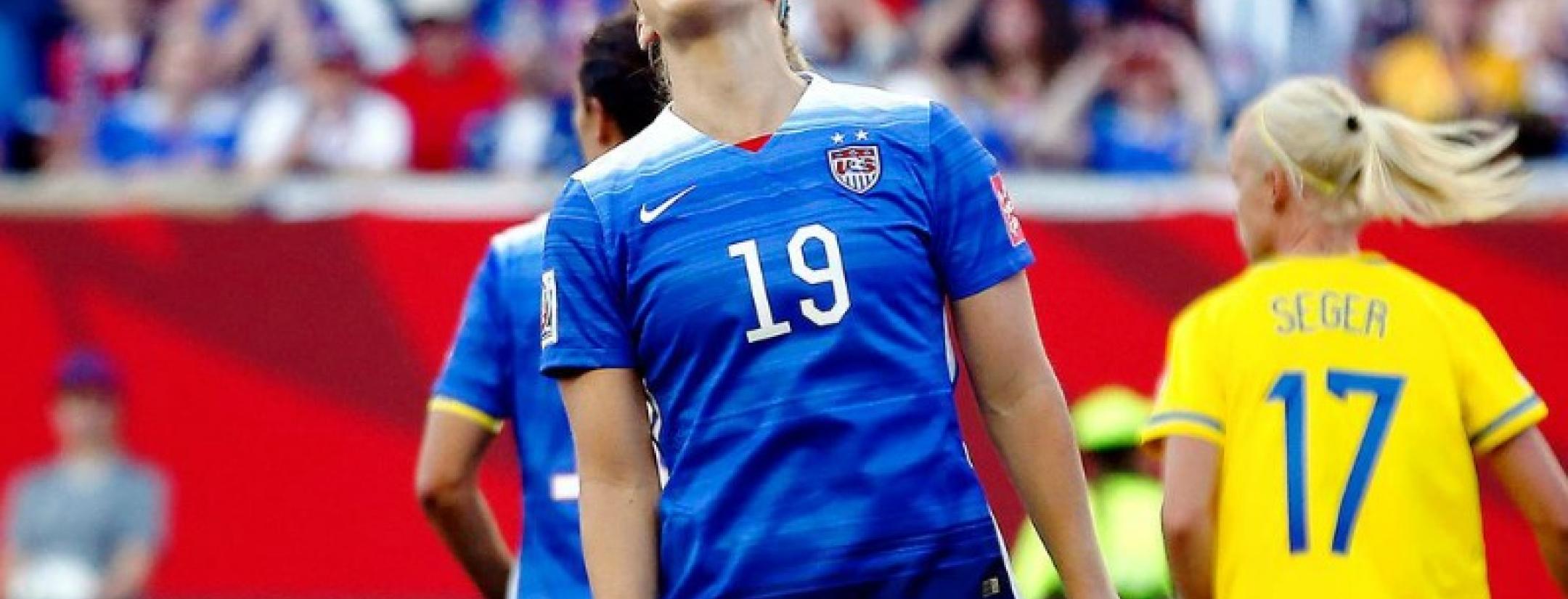 Julie Johnston is pictured with her head thrown back, yelling in frustration during the USA Sweden game. 