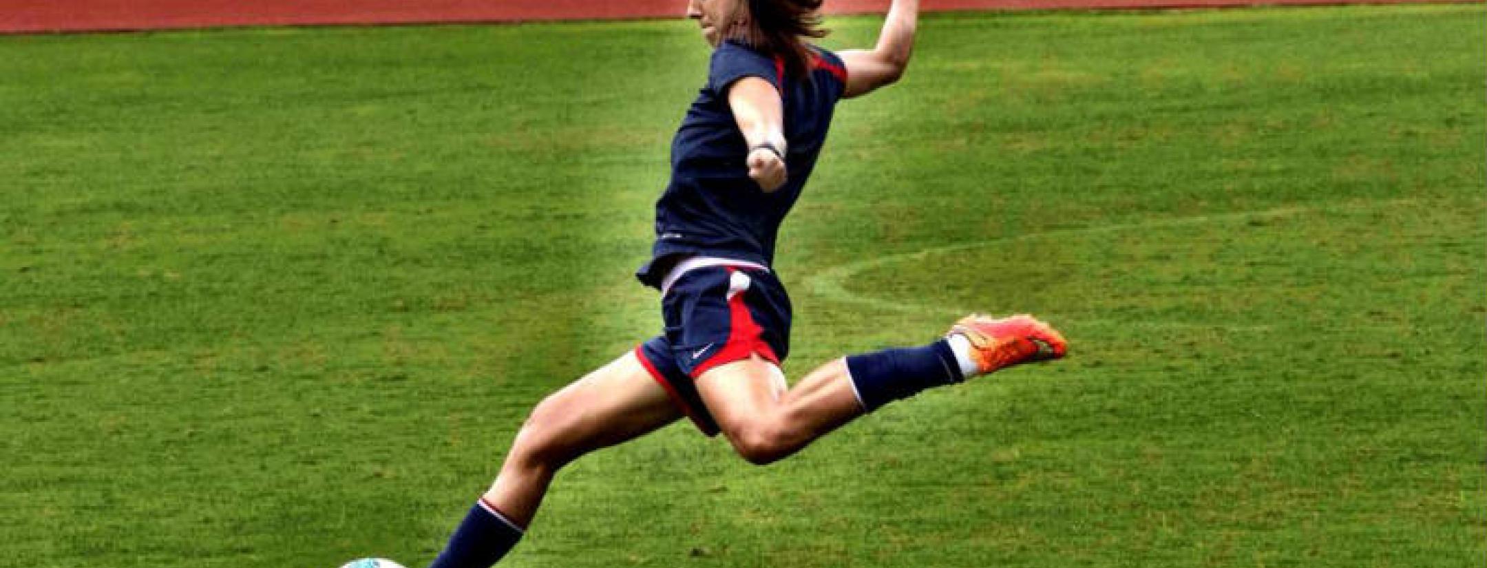 Alex Morgan of the United States Women's National Team in Action kicking A Ball