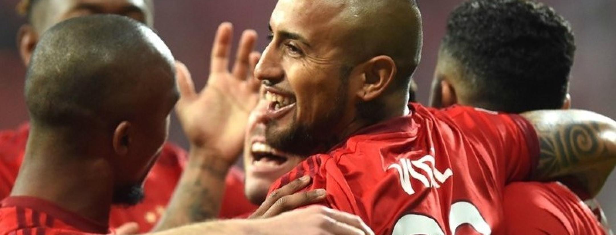 Arturo Vidal and company celebrates his early goal. 