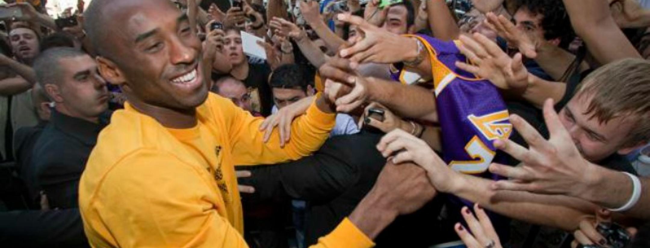 Kobe Bryant out shaking hands with the masses.