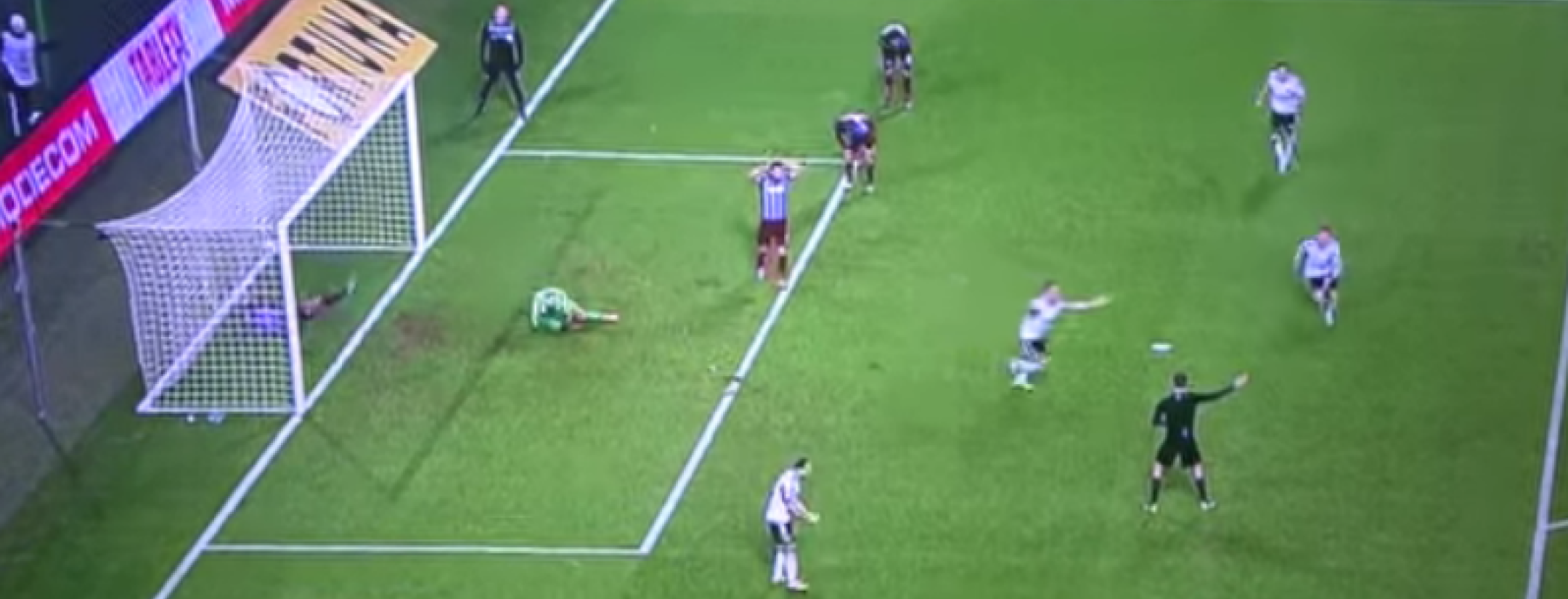 a team celebrates while the other is in disbelief.