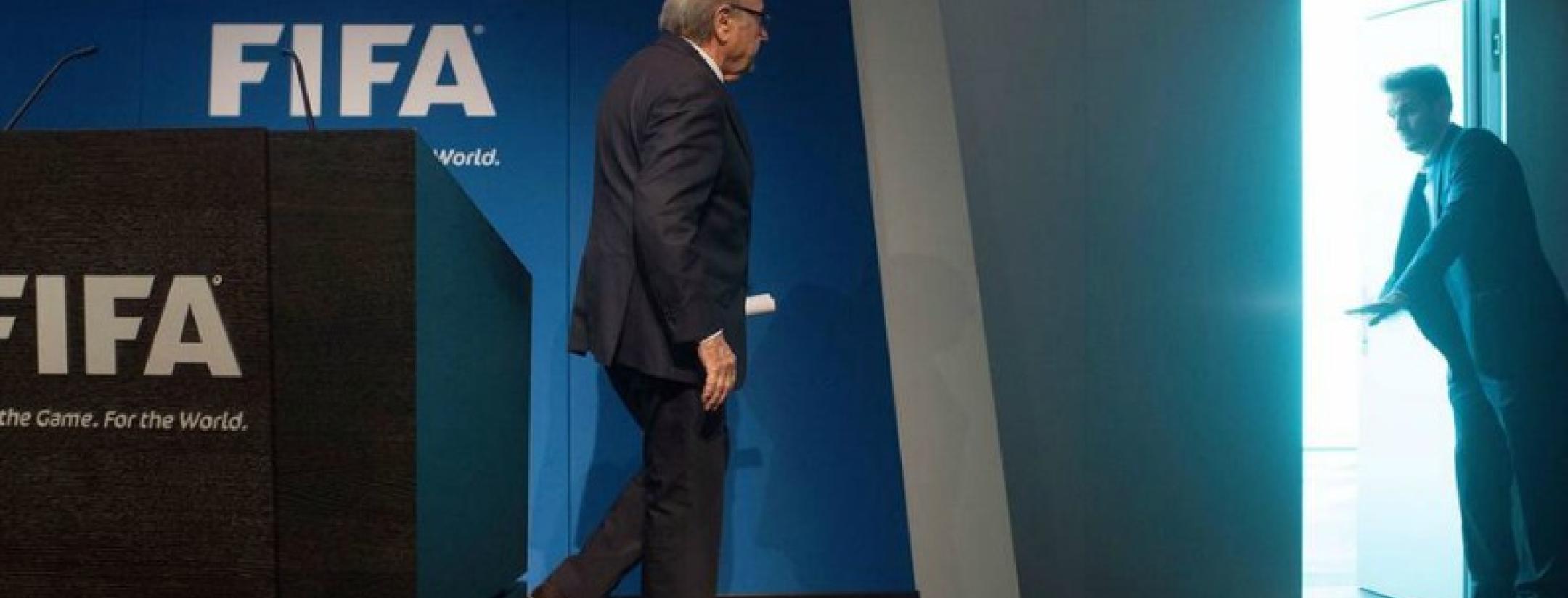 Blatter leaving the conference room after his resignation speech. 