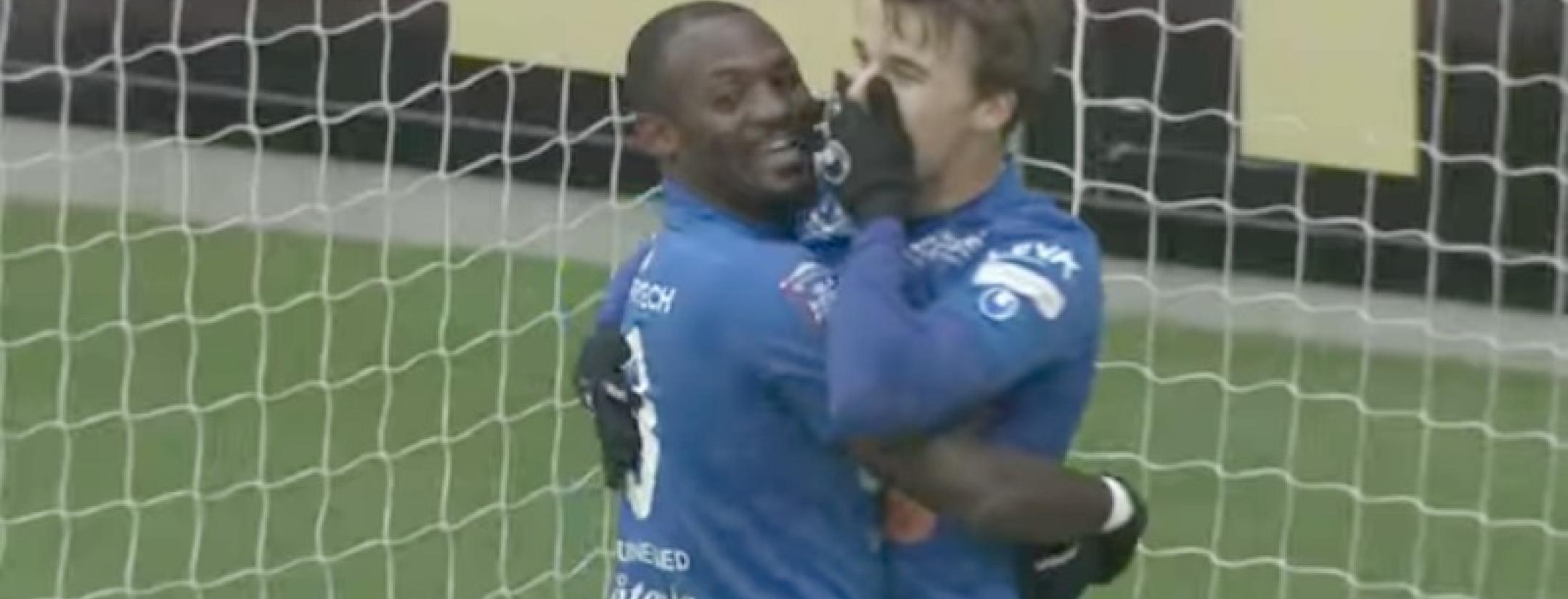 two teammates hold eachother in disbelief, swedish-goal