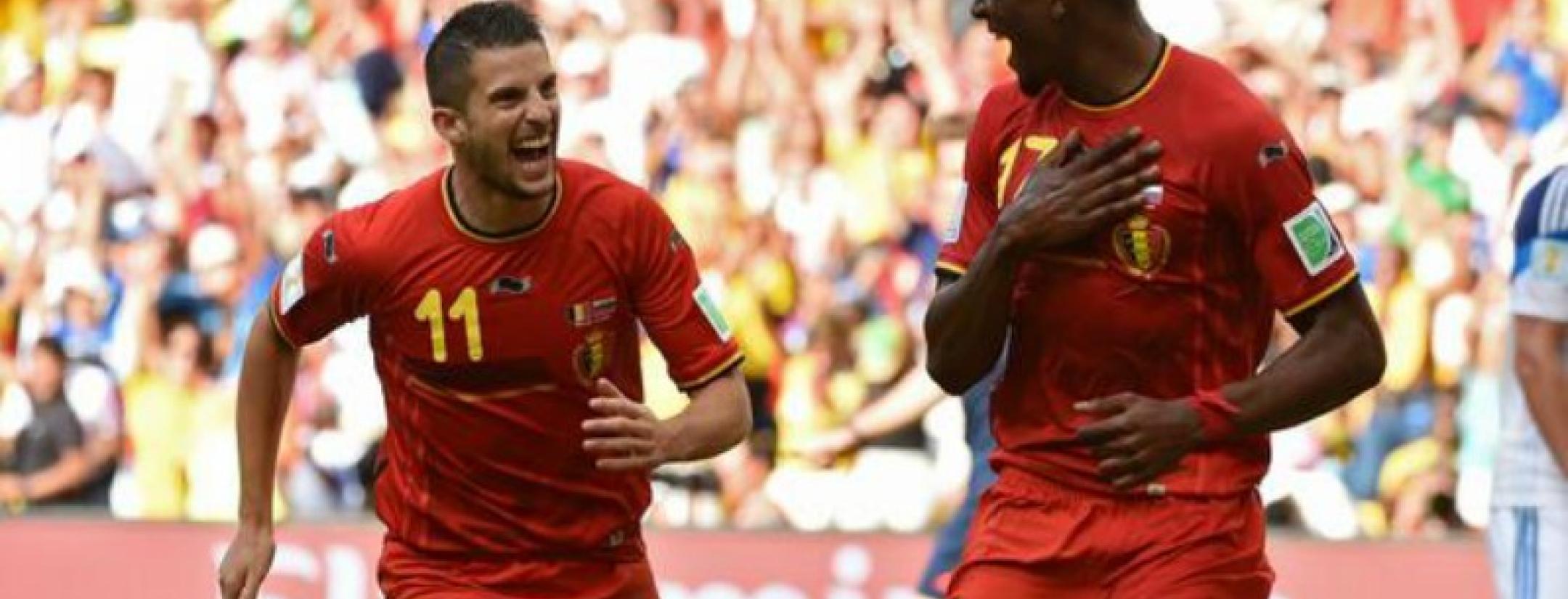 Origi celebrates his goal with Mertens