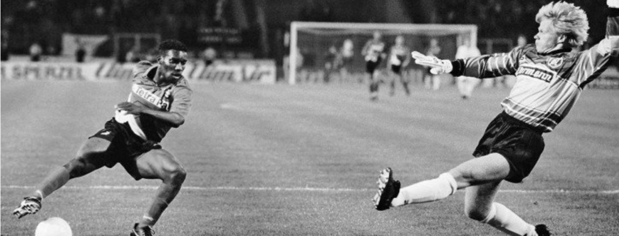 Jay-Jay Okocha scores on Oliver Kahn