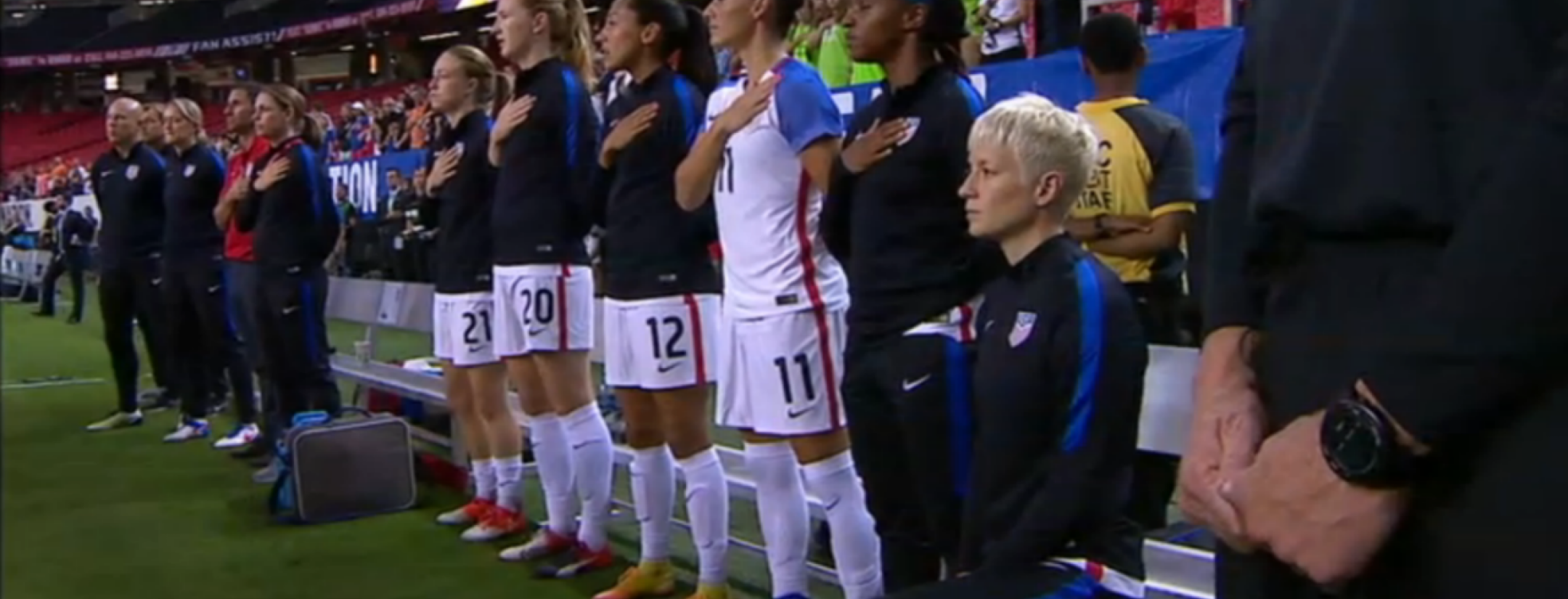Megan Rapinoe kneels during the anthem.
