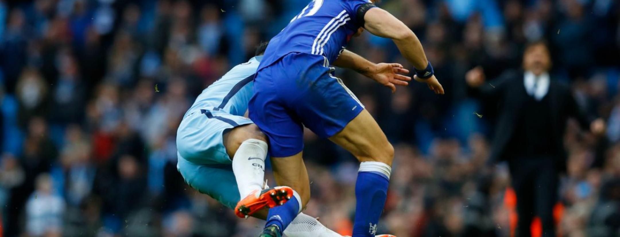 David Luiz responds to Sergio Aguero's tackle.
