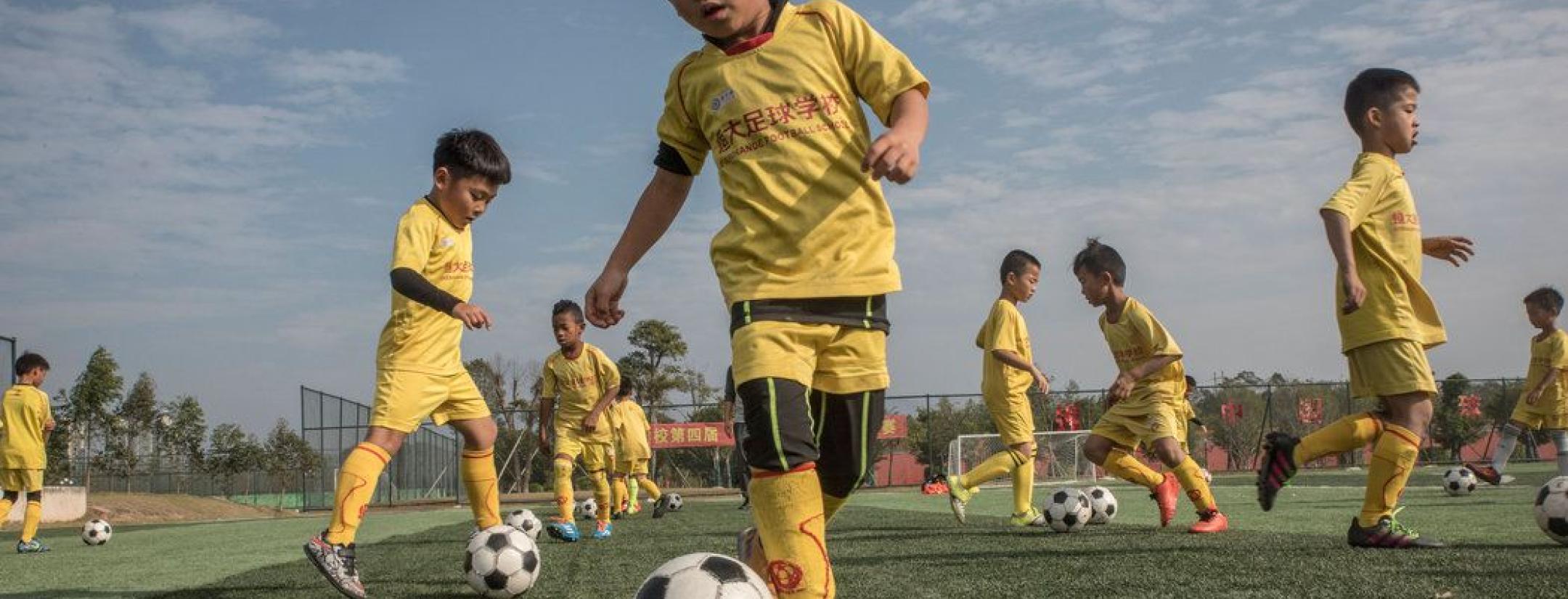 Chinese schools will receive new football pitches and training facilities.