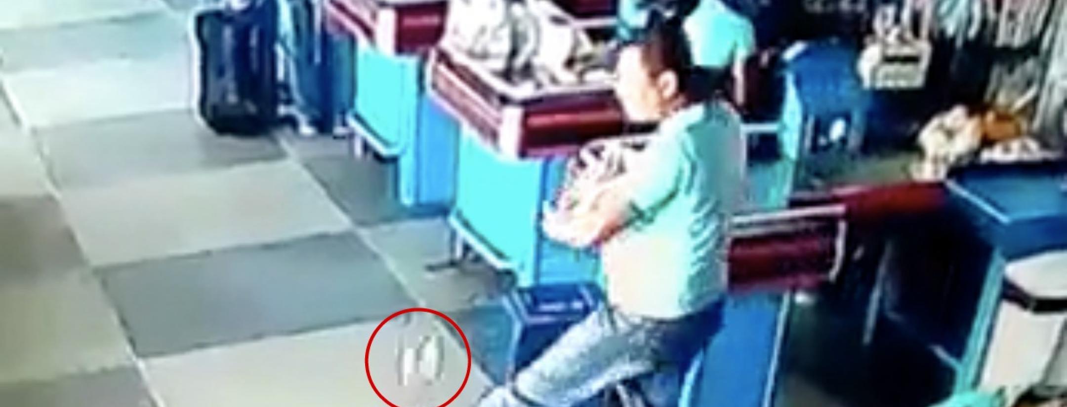 Man juggles groceries in Brazilian supermarket